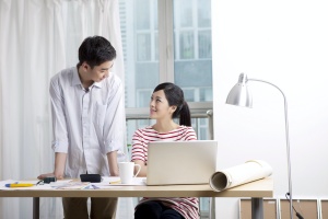 couple at home working on Savings Strategies