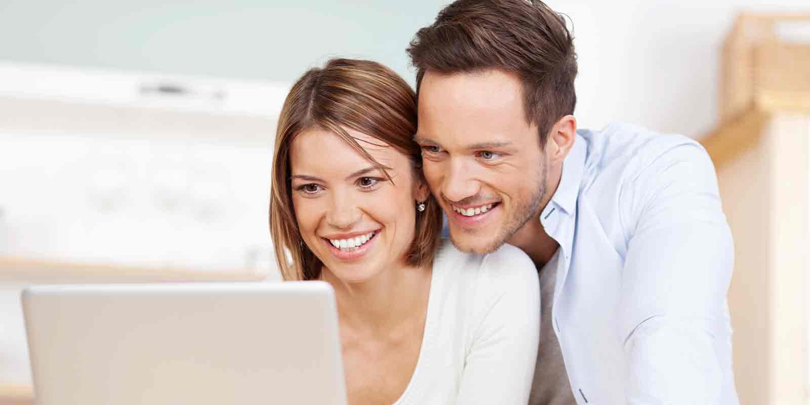 couple on computer Organizing Finances