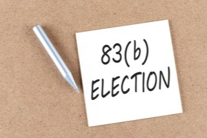 83b Election written on a paper and a pen on a surface
