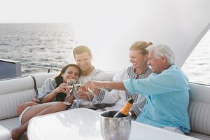 A family of four enjoying their vacation on a yacht