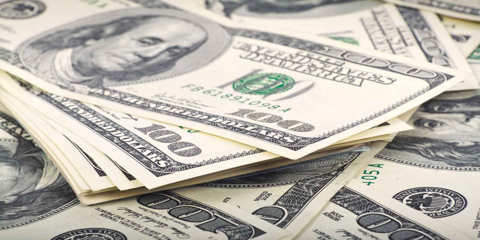 A lot of dollar bills indicating generational wealth