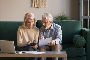 An elderly couple doing retirement planning